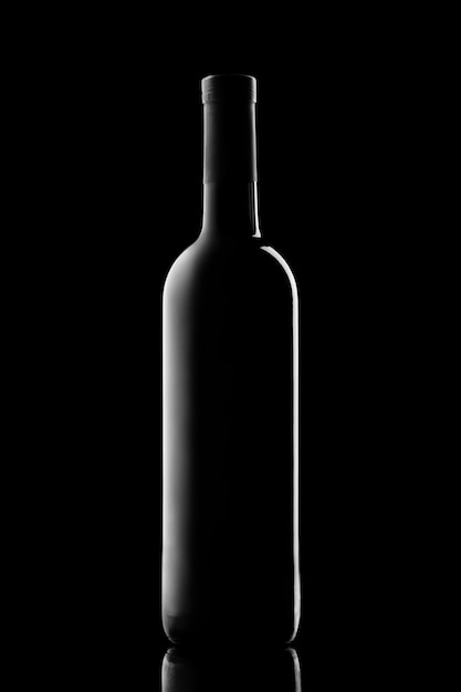 Illuminated silhouette of a bottle with wine on a black background