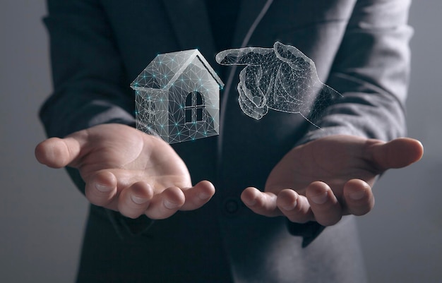 Illustrated house and hand from the net Man holding in his hands