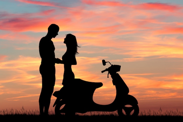 illustration of couple on motor scooter at sunset