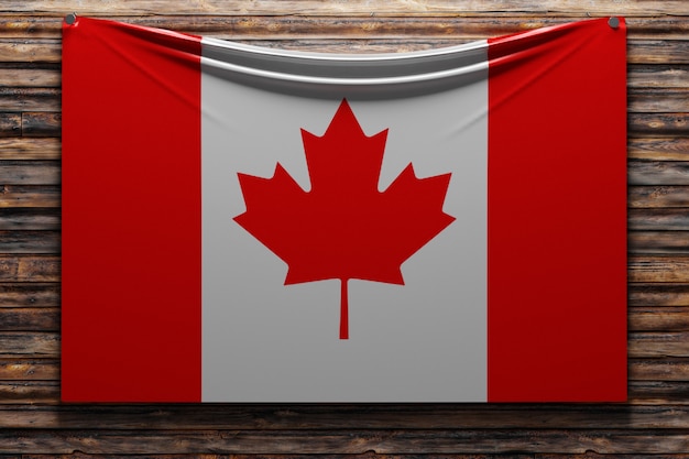 illustration of the national   fabric flag of Canada  nailed on a wooden wall