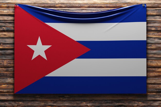 illustration of the national   fabric flag of Cuba  nailed on a wooden wall