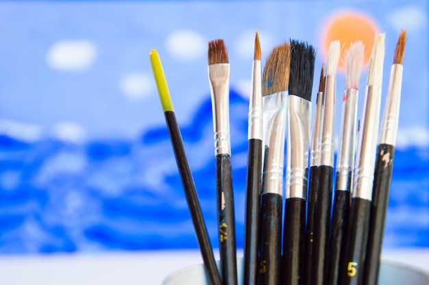 Illustrator paintbrushes with color palette on watercolor draw background