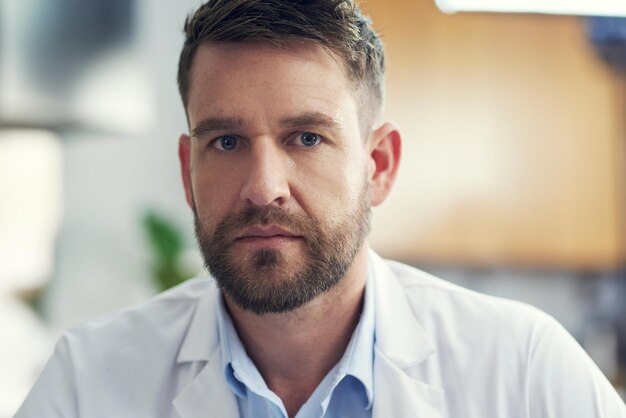 Im serious about healthcare Cropped portrait of a handsome male doctor sitting in his office