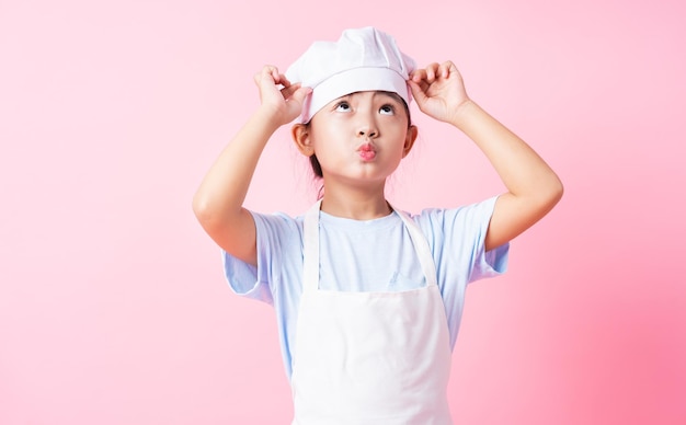 Image of Asian child practicing to be a chef