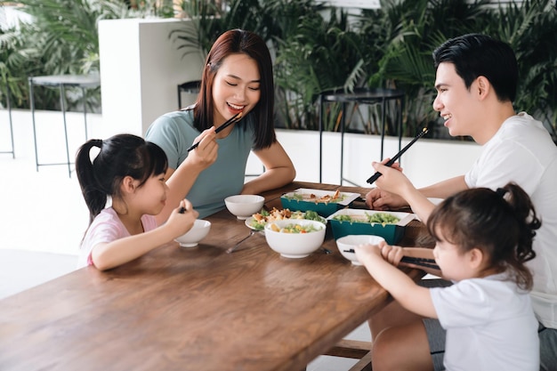 Image of Asian family eating lunch together