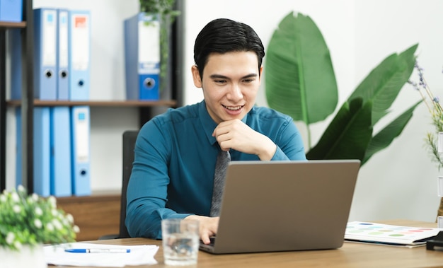 Image of Asian male businessman working in the office