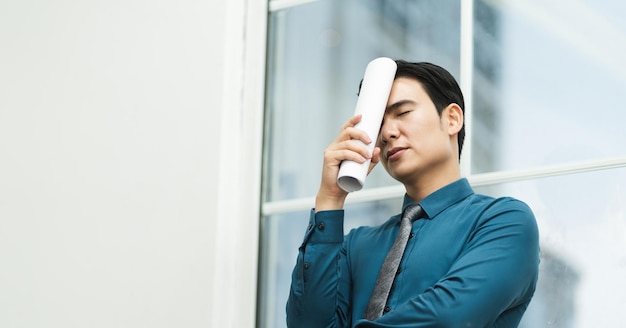 Image of Asian male businessman working in the office