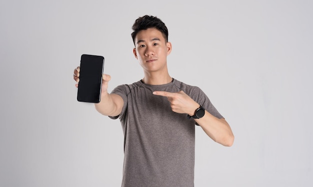 Image of Asian man exercising on white background