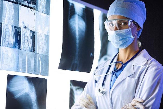 Image of attractive woman doctor looking at xray results