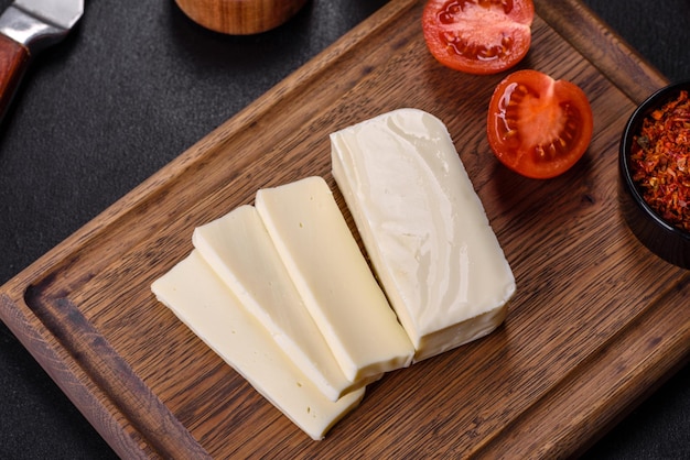 Image of a bar and grated mozzarella cheese on a dark background