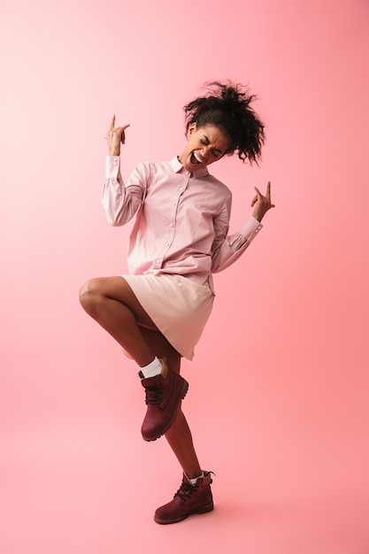 Image of a beautiful emotional young african woman posing isolated screaming.