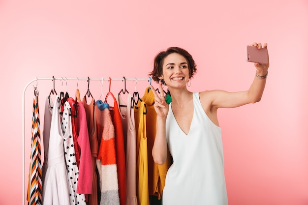 Image of a beautiful happy woman stylist posing isolated 