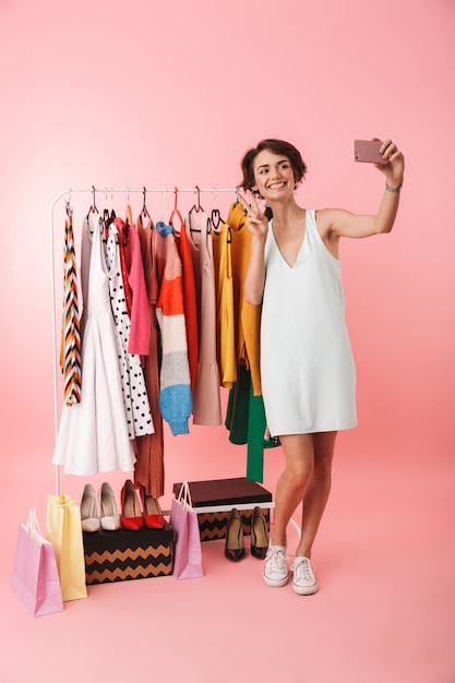 Image of a beautiful happy woman stylist posing isolated 