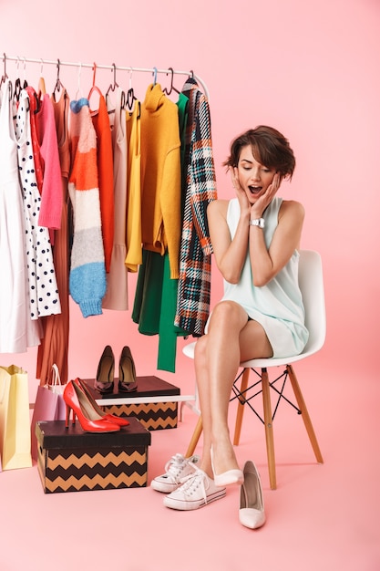 Image of a beautiful shocked woman stylist posing isolated 