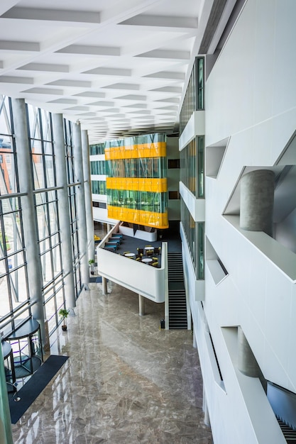 Image of big windows passing daylight inside office building Sunny on modern glass windows building interior corridor