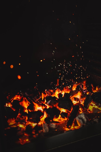 Image of burning coals in a restaurant grill