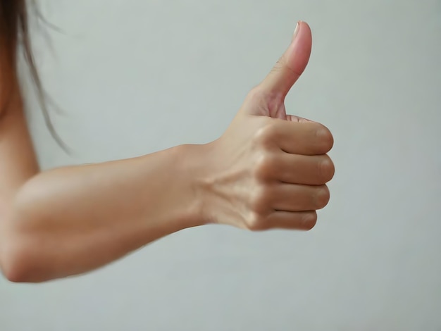 image of the close shot of someone hand showing thumbs up