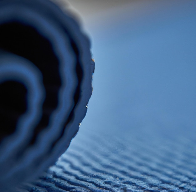 Image of close up of blue yoga mat with pattern