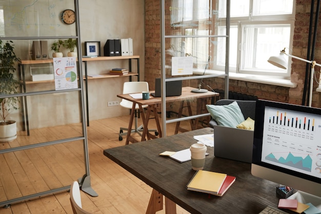 Image of empty modern office with workplace with computer on it