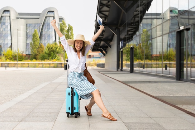 Image of excited young pretty woman tourist posing.