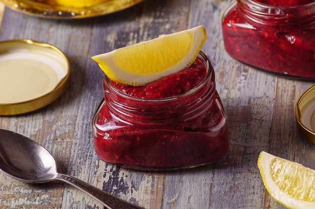 An image of  fresh red berry smoothie on a board. 