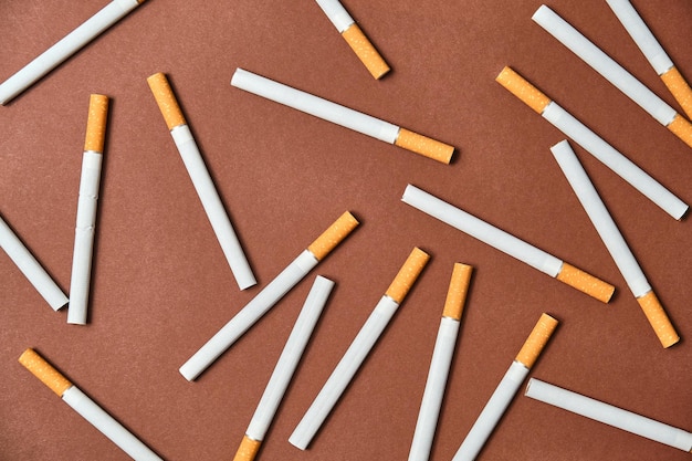 Image from above of a pile of unlit cigarettes