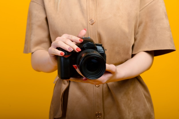 Image of hands with digital photo camera