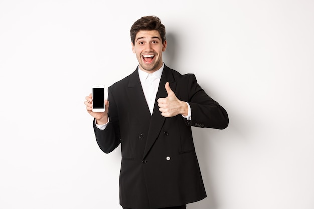 Image of handsome male entrepreneur in black suit