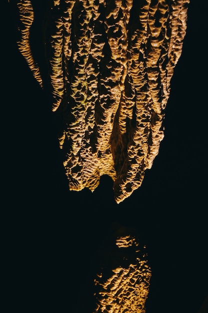 Image of High contrast detail of rock formations in cave stalagmites and stalactites