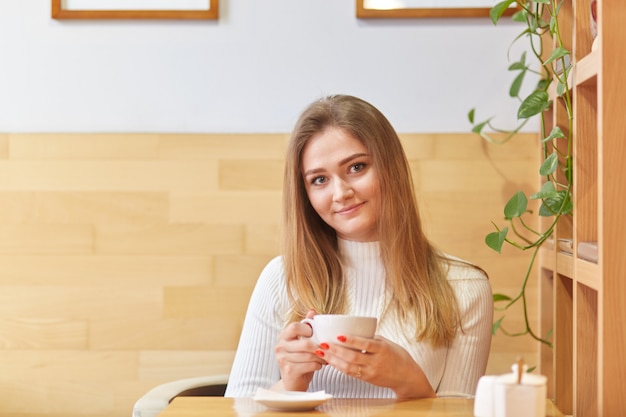 Image of lovely young female model with straight light hair