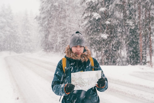 Image of man with map in hands for walk