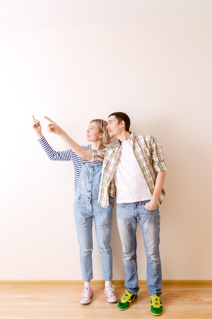 Image of man and woman in new empty apartment