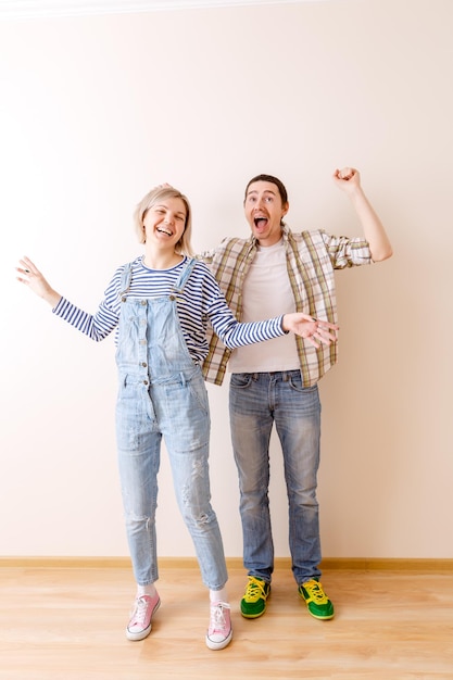 Image of man and woman in new empty apartment