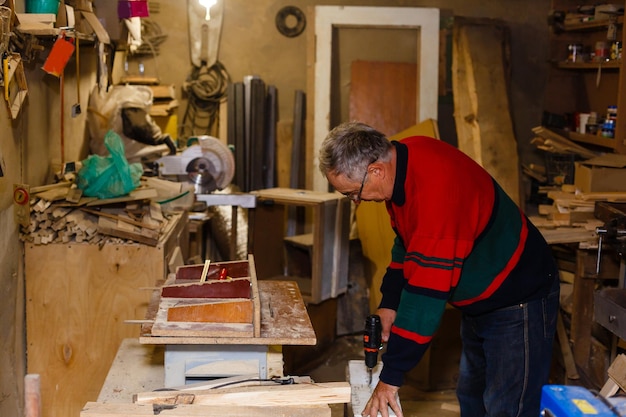 Image of mature carpenter in the workshop