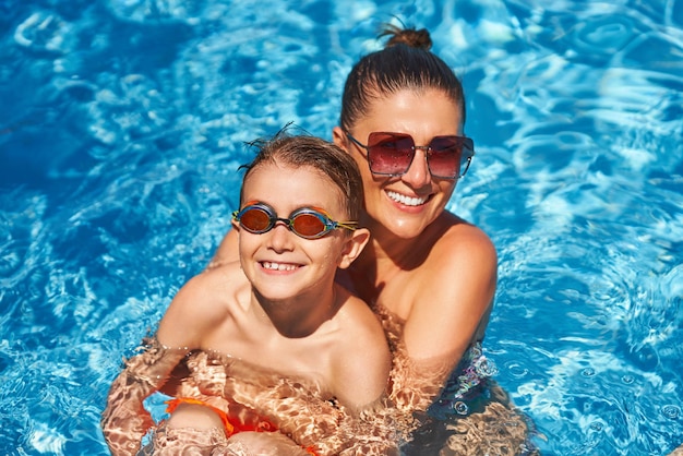 Image of mother with son in the pool