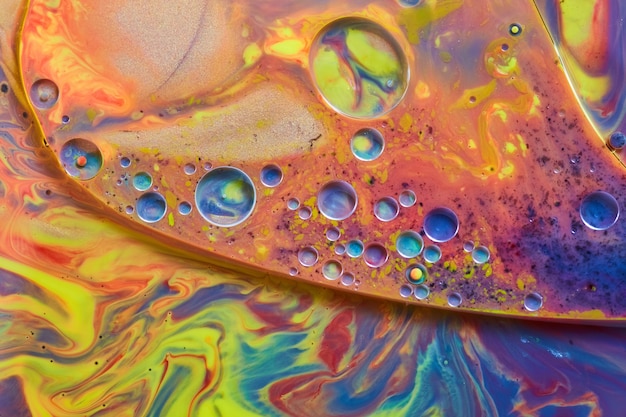 Image of Mysterious liquid of rainbow colors and small shiny spheres