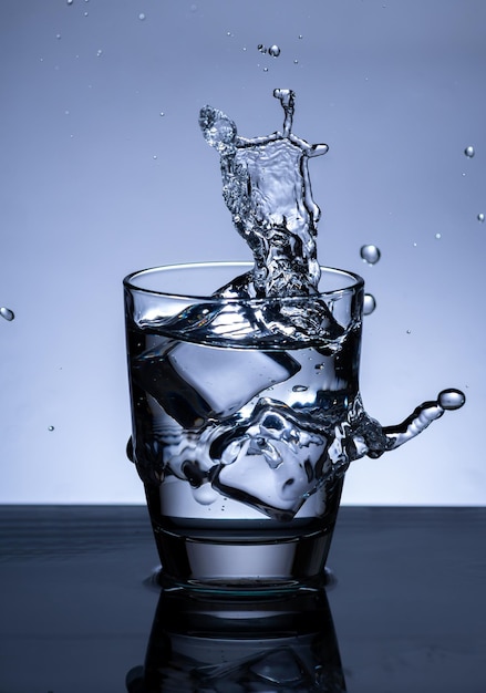 The image of pouring drinking water into a glass