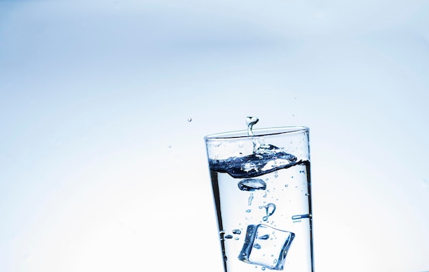 The image of pouring drinking water into a glass