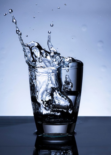 The image of pouring drinking water into a glass