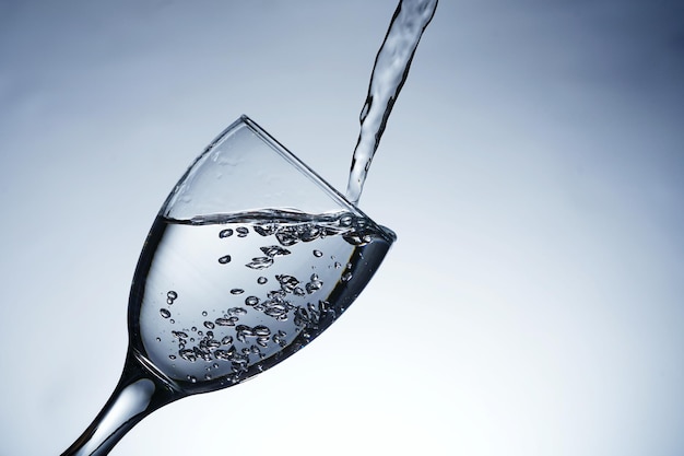 Image of pouring water into a glass