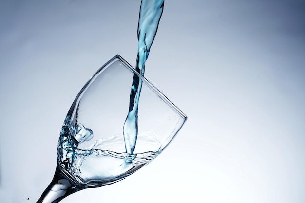 Image of pouring water into a glass