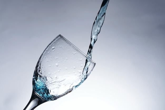 Image of pouring water into a glass