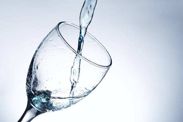 Image of pouring water into a glass