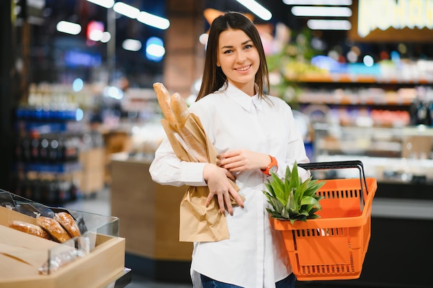 Image of pretty woman with pack of bread