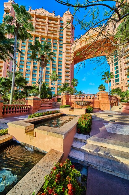 Image of Resort and manmade waterfall buckets in tropics with palm trees