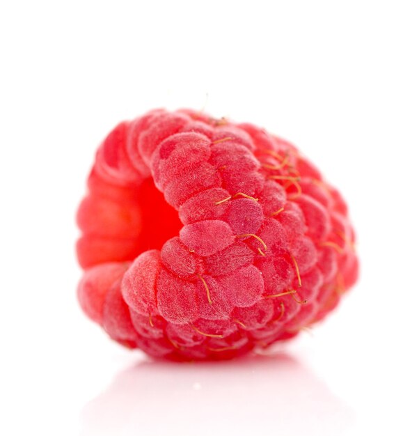 image of a ripe raspberry as is on white background close up