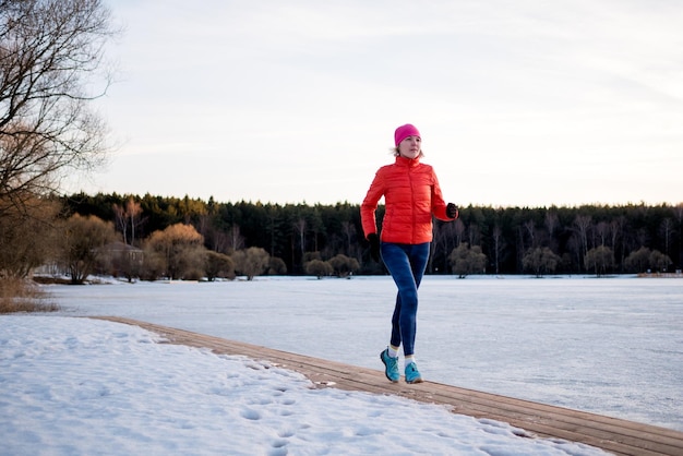 Image of sports girl on morning exercise in winter