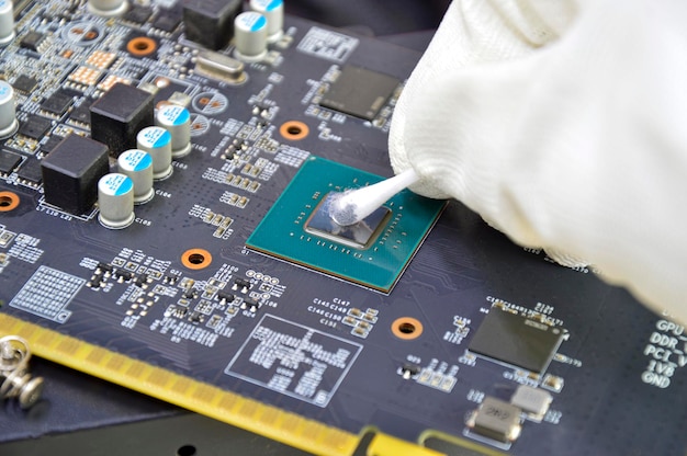 Image of technician cleaning the CPU chip