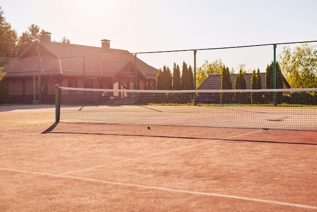 Image of a tennis court in the light of the setting sun The concept of tennis competitions