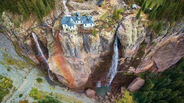 Image of View of power station at top of cliffs with waterfalls